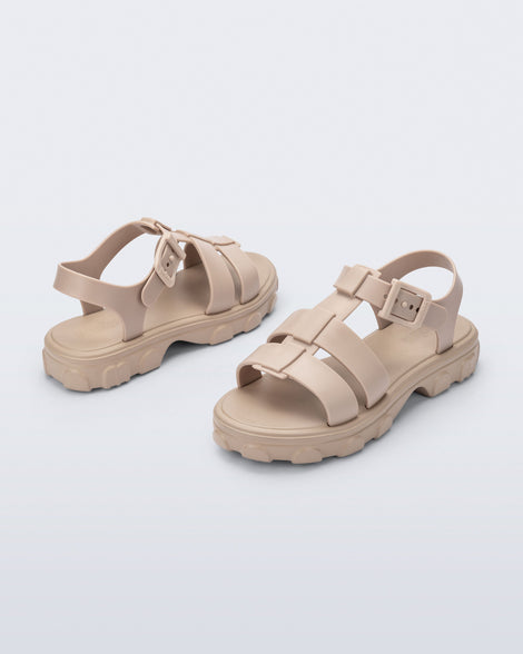 Back and angled view of a pair of beige Ella sandals