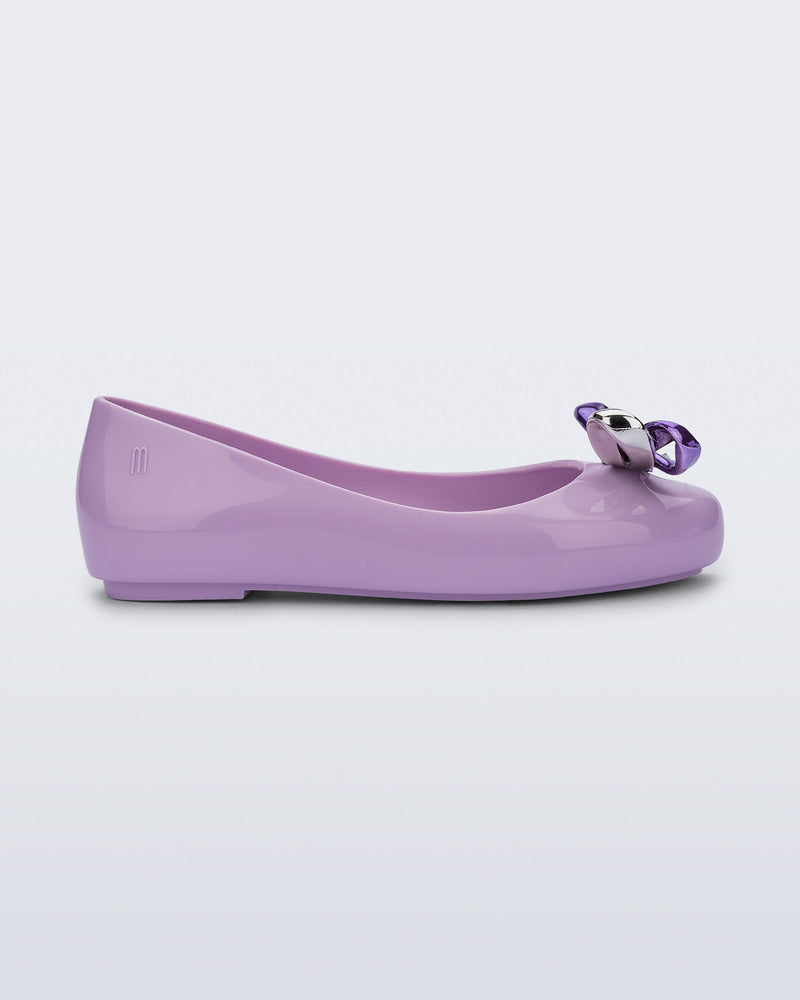Side view of a purple Sweet Love Glam kids ballerina flats with bow