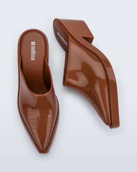 Side and top view of a pair of brown Texas Mule heels