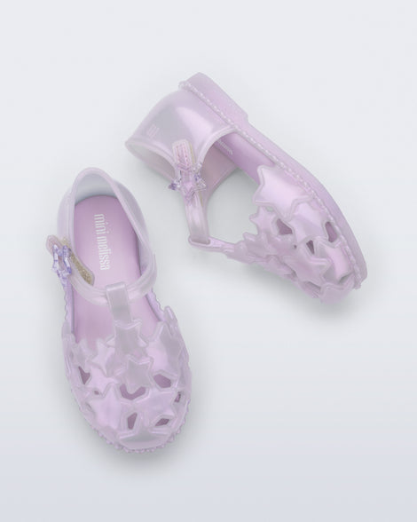 Side and top view of a pair of pearly lilac Starry baby sandals
