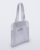 Angled view of a clear Harper bag with shoulder straps