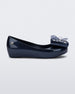 Side view of a Mini Melissa Ultragirl peeptoe ballet flat in blue with star printed butterfly bow applique. 