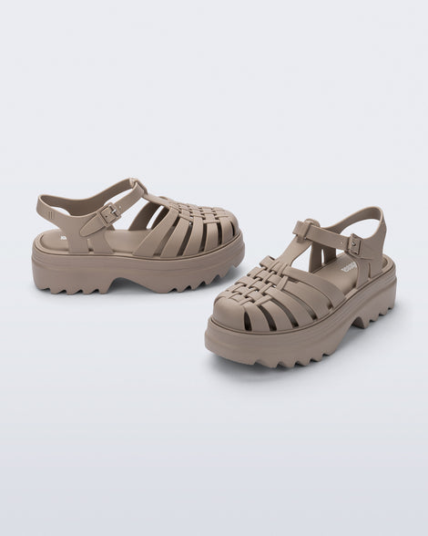 Angled and side view of a pair of dark beige Possession Platform II sandals