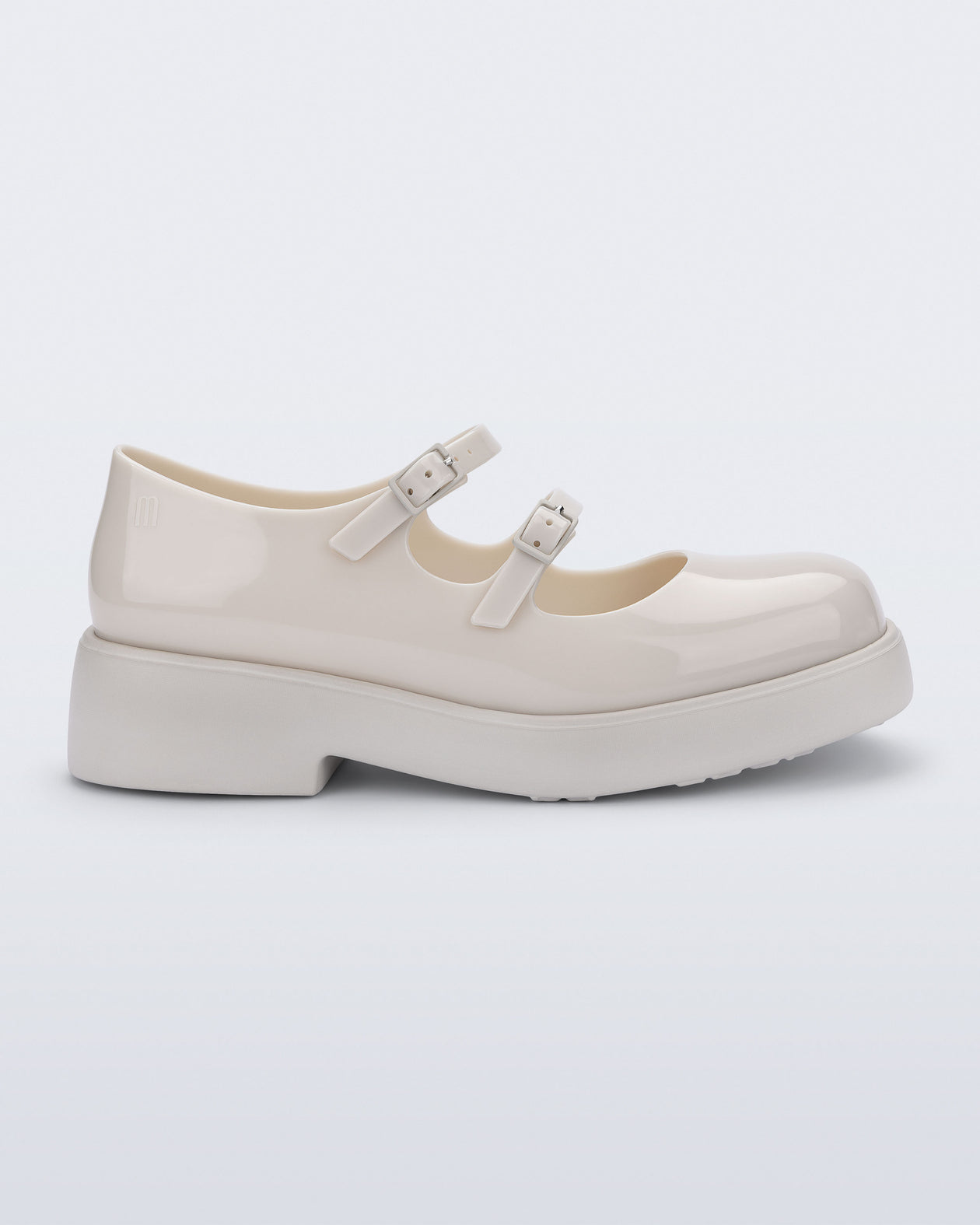 Side view of a beige Farah Low Mary jane loafer