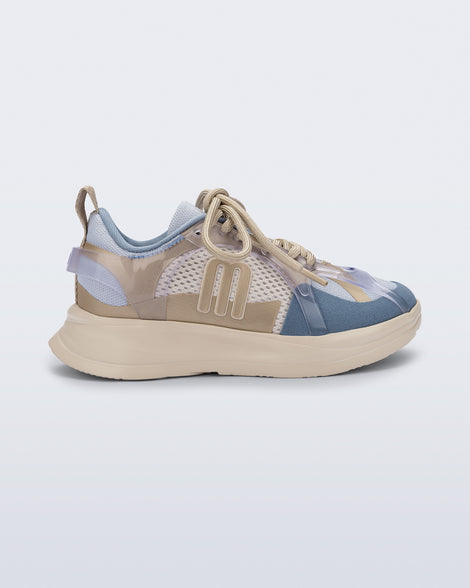 Side view of a blue X Beat kids sneaker with beige trim
