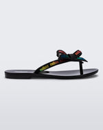 Side view of a black Harmonic M Lover adult flip flop with rainbow Melissa logo on strap