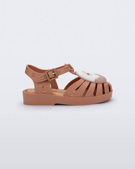 Side view of a beige Possession + Pop Mart Pucky fisherman baby sandal