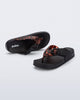 Top and angled view of a black Cozy Thong Flip flop with brown tortoise strap