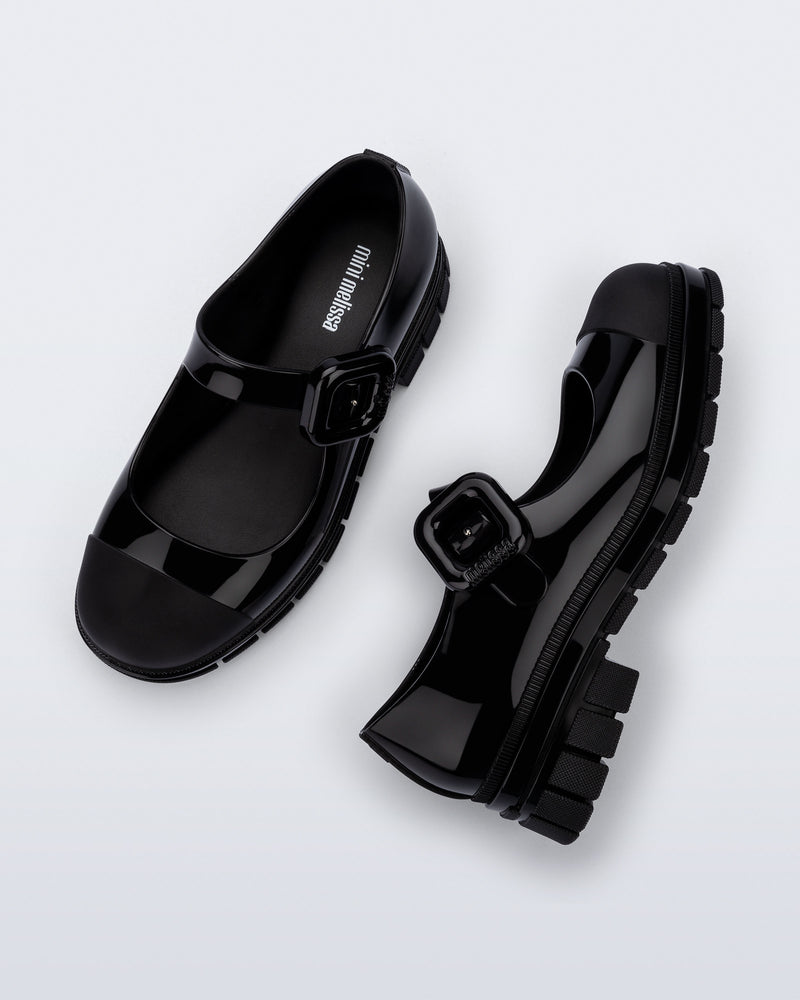 Top and side  view of a pair of black June mary janes with matte toe cap