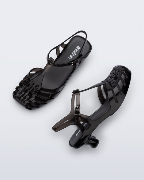 Top and side view of a pair of clear black Vixen Kitten Heel sandals