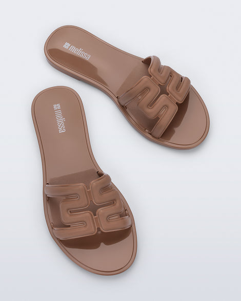 Top view of a pair of brown M Slide sandals