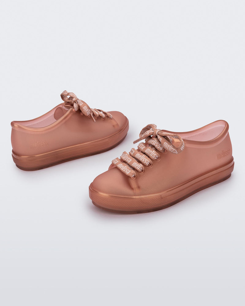 Angled view of a pair of pearly brown Hip M Lover kids sneakers with laces.