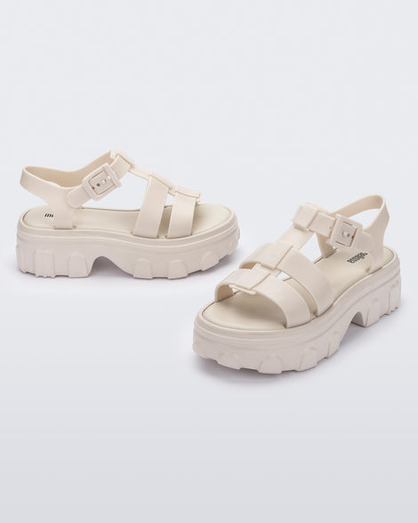 Side and front view of a pair of beige Ella women's platform sandals