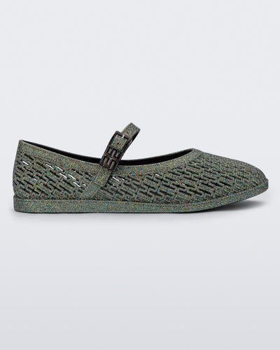 Side view of a dark silver glitter Harper flat with strap
