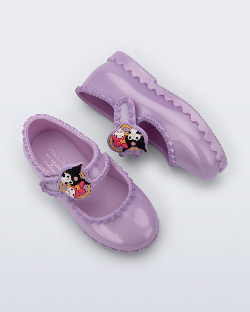 Top and side view of a pair of pearly lilac Hip Ballerina + Hello Kitty baby flats 