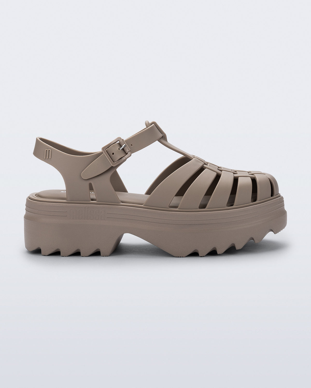 Side view of a dark beige Possession Platform II sandal