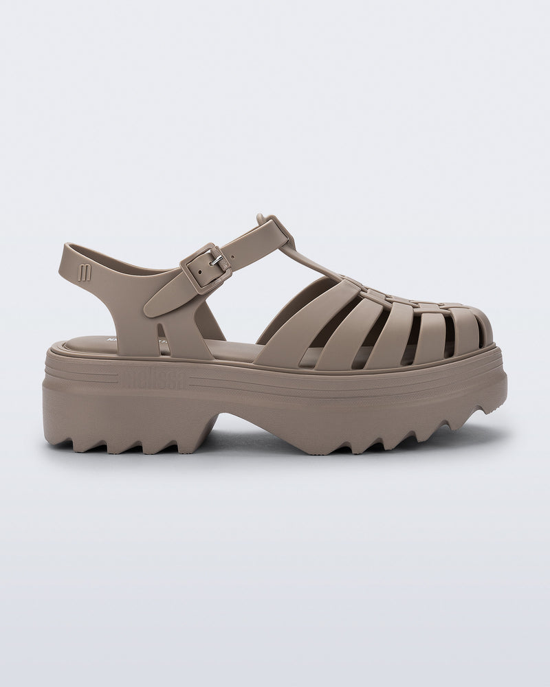 Side view of a dark beige Possession Platform II sandal