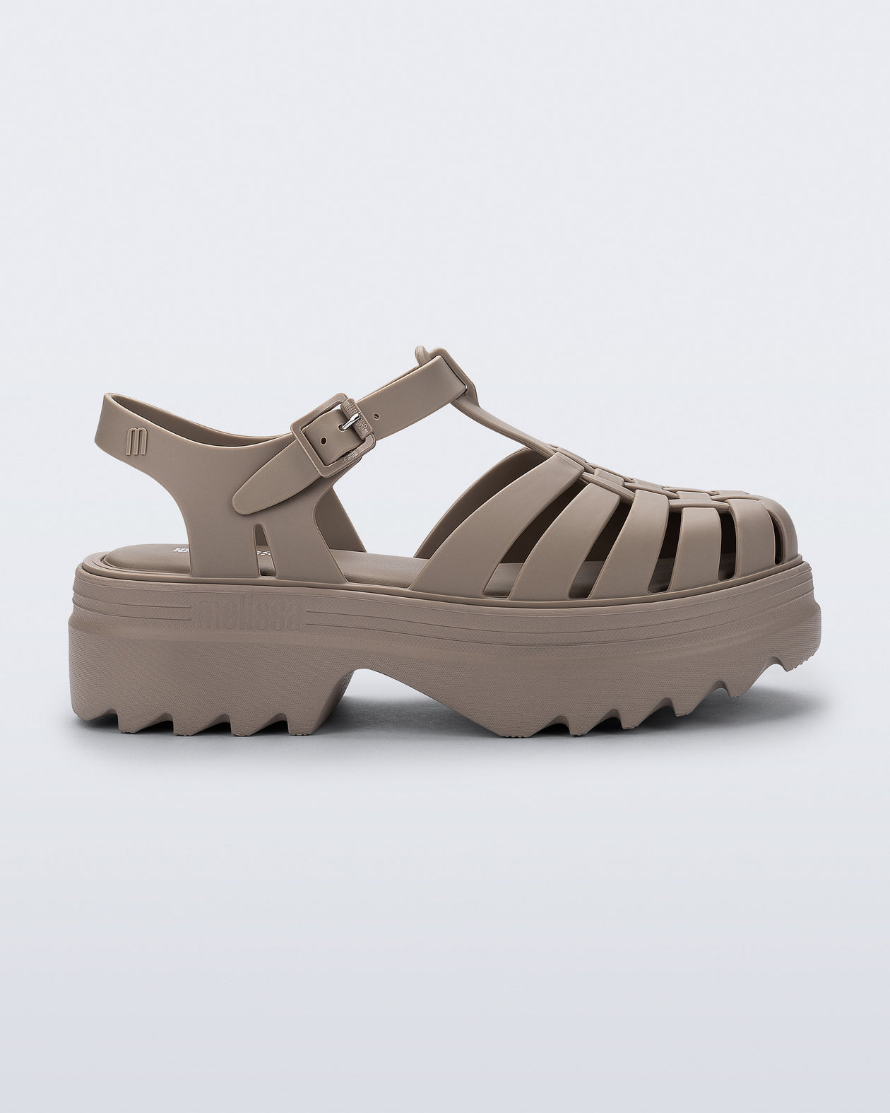 Side view of a dark beige Possession Platform II sandal