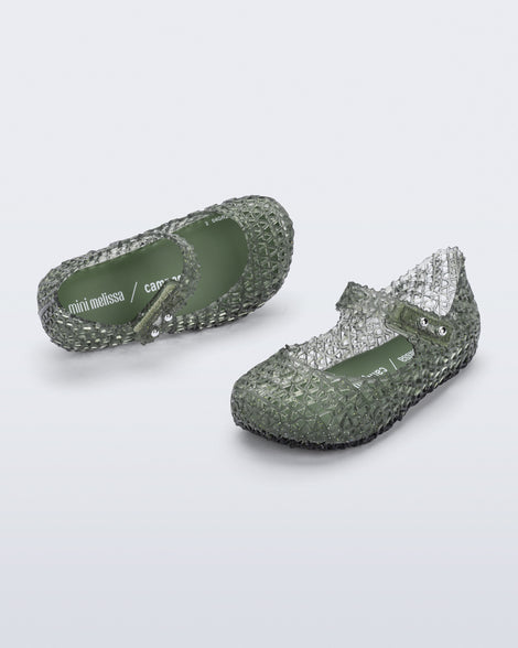Angled and top view of a pair of glitter green Campana baby flats
