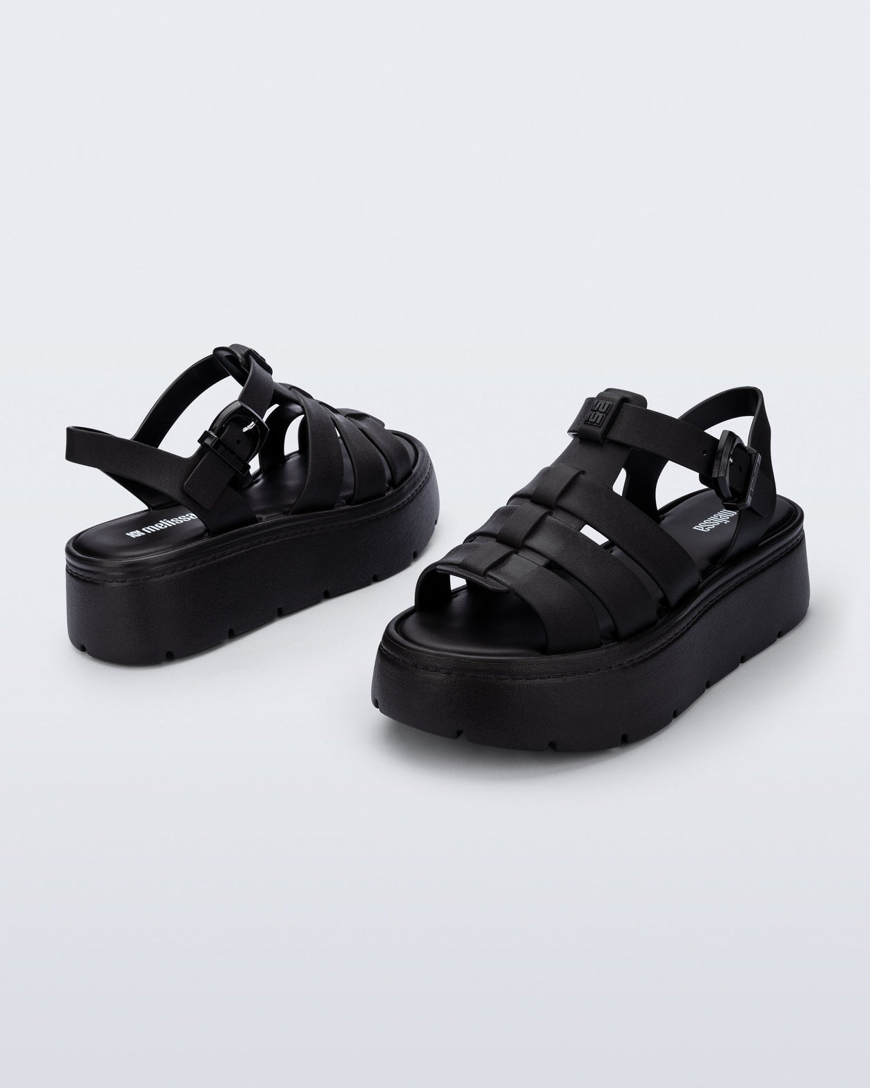 Back and angled view of a pair of black Up Platform sandals