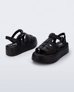 Back and angled view of a pair of black Up Platform sandals