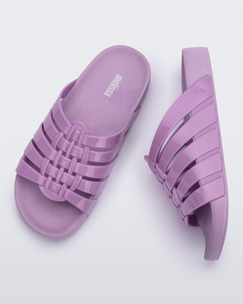 Top and side view of a pair of lilac Possession Slide
