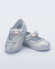 Angled view of a pair of pearly blue Hip Ballerina + Hello Kitty baby flats