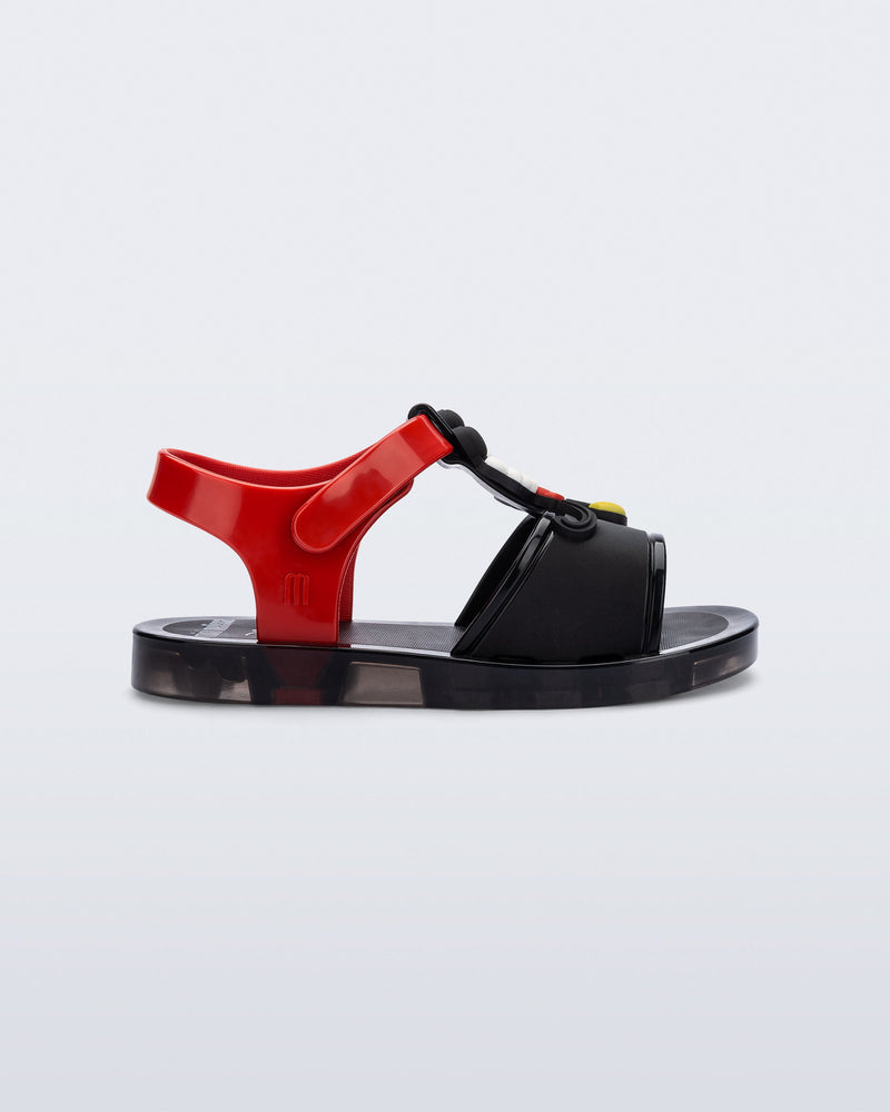 Side view of a black  Play Mickey & Minnie sandals with red straps