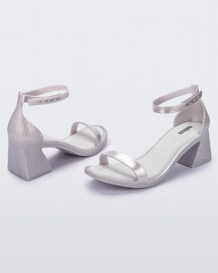 Product element, title Lux Heel in Metallic Silver/White
 price $59.50