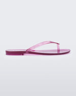 Side view of a clear lilac Harmonic Jelly flip flop