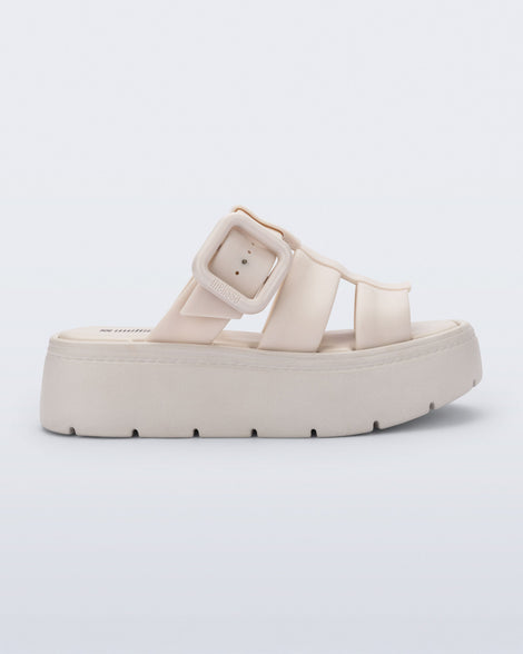 Side view of a beige Pump Platform sandal