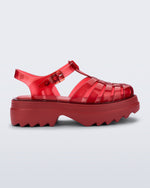 Side view of a transparent red Possession Platform II sandal