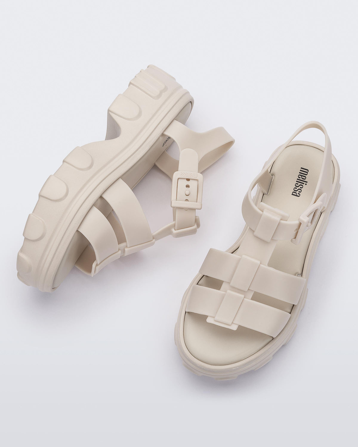 Side and top view of a pair of beige Ella women's platform sandals
