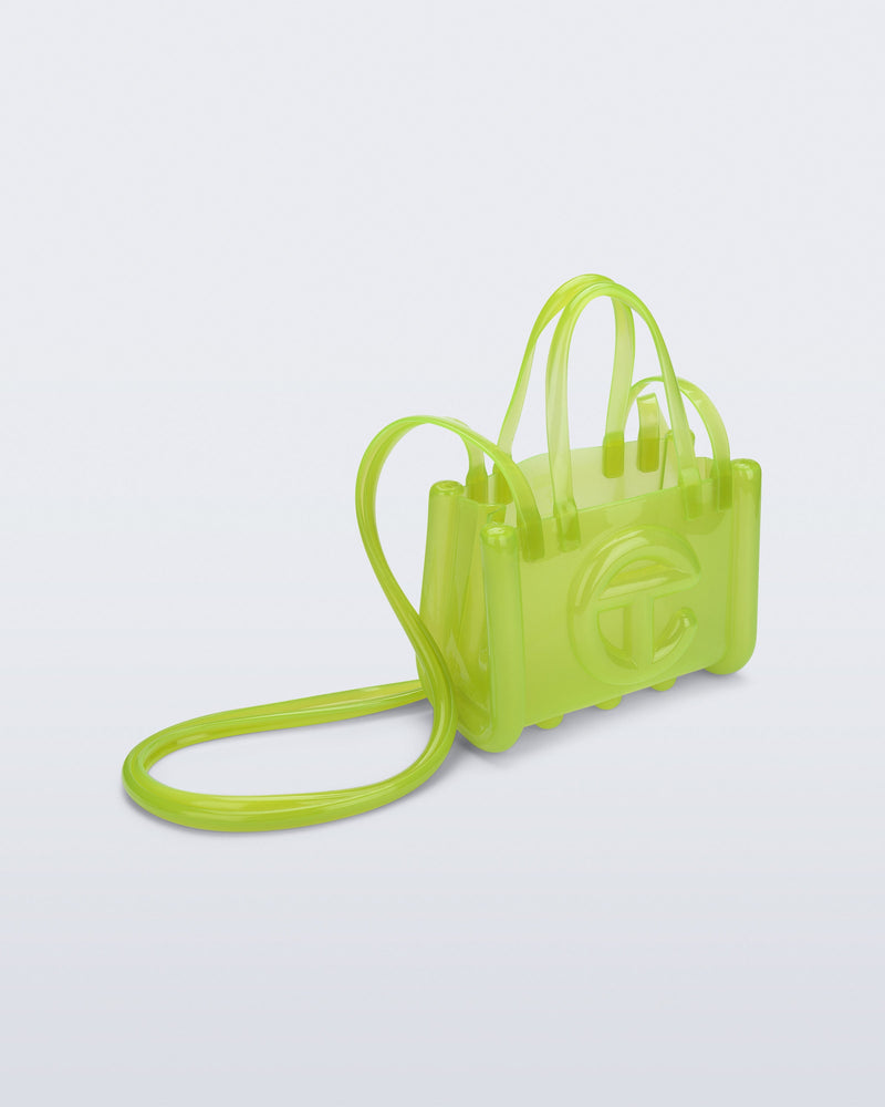 Angled view of the green Small Jelly Shopper x Telfar bag