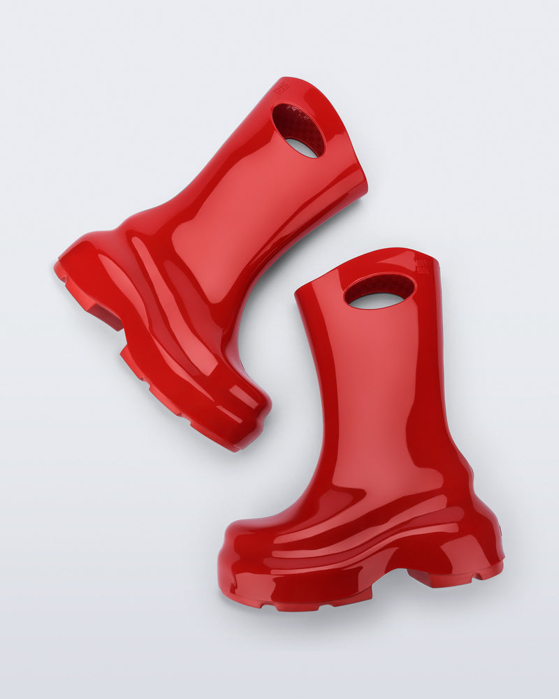 Top view of a pair of red Ultra platform rain Boot with circle cutout on top