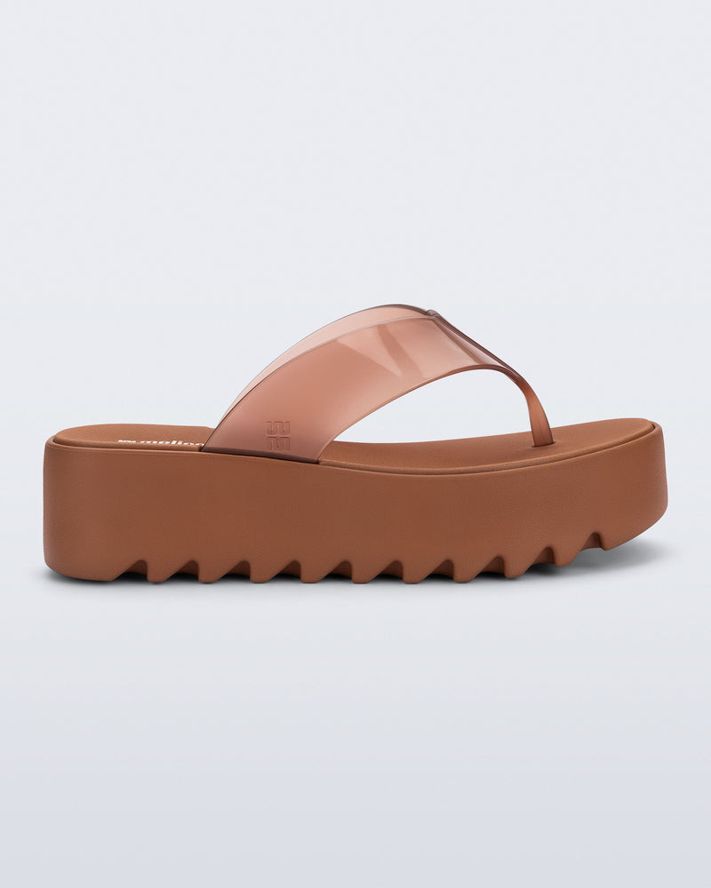 Side view of a brown Thong Platform flip flop