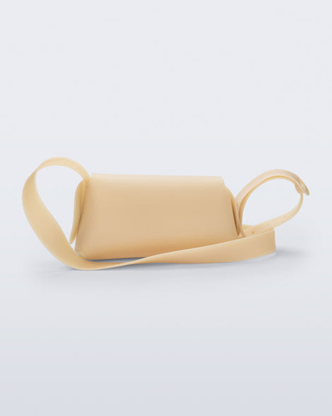 Back view of a beige Cross Bag with adjustable strap