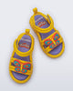 Top view of a pair of yellow Create + Play Doh sandals with Butterfly