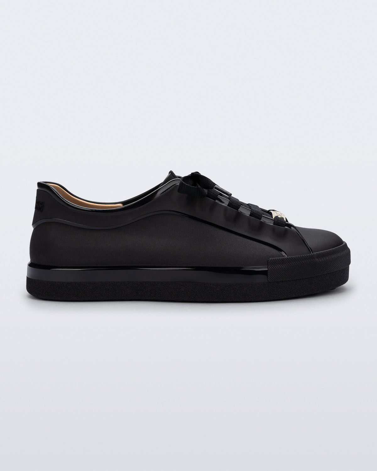 Side view of a black Wow Sneaker with black shoe laces