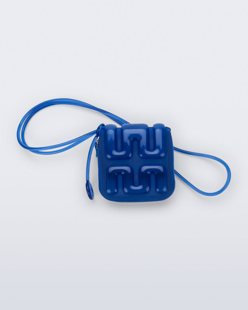 Back view of a blue Jelly Wallet with inside pocket and zipper