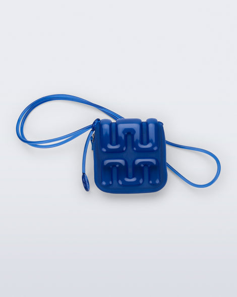Back view of a blue Jelly Wallet with inside pocket and zipper