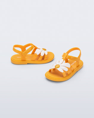 Side and angled view of a pair of orange Hip Bloom baby sandals