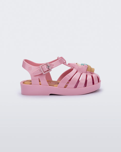 Side view of a pink Possession + Pop Mart Pucky fisherman baby sandal