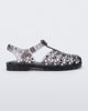 Side view of a clear black Possession Crystals sandal