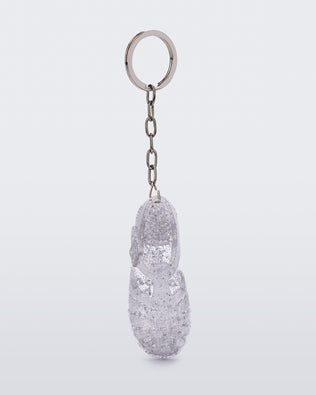 Front angled view of glitter clear Possession keyring