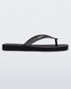 Side view of a black with silver strap Sun Long Beach flip flop