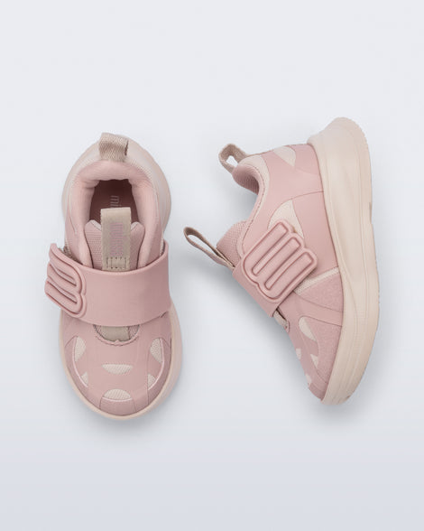 Side and top view of a pair of pink X Beat baby sneakers