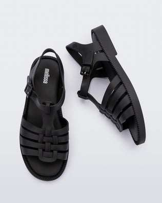 Top and side view of a pair of matte black Possession Fresh fisherman style sandals with open toe.