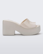 Side view of a beige Posh platform heel