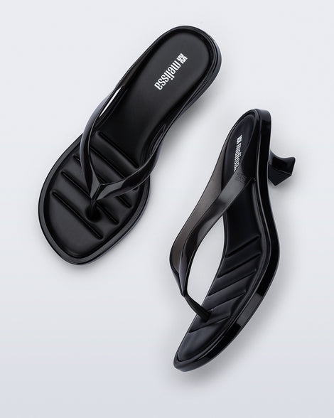 Top and side view of a pair of black Flip Flop Kitten Heels